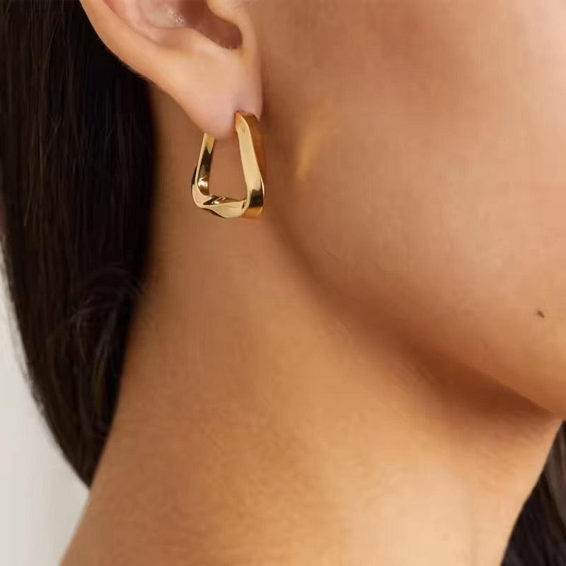 Gold stud earrings