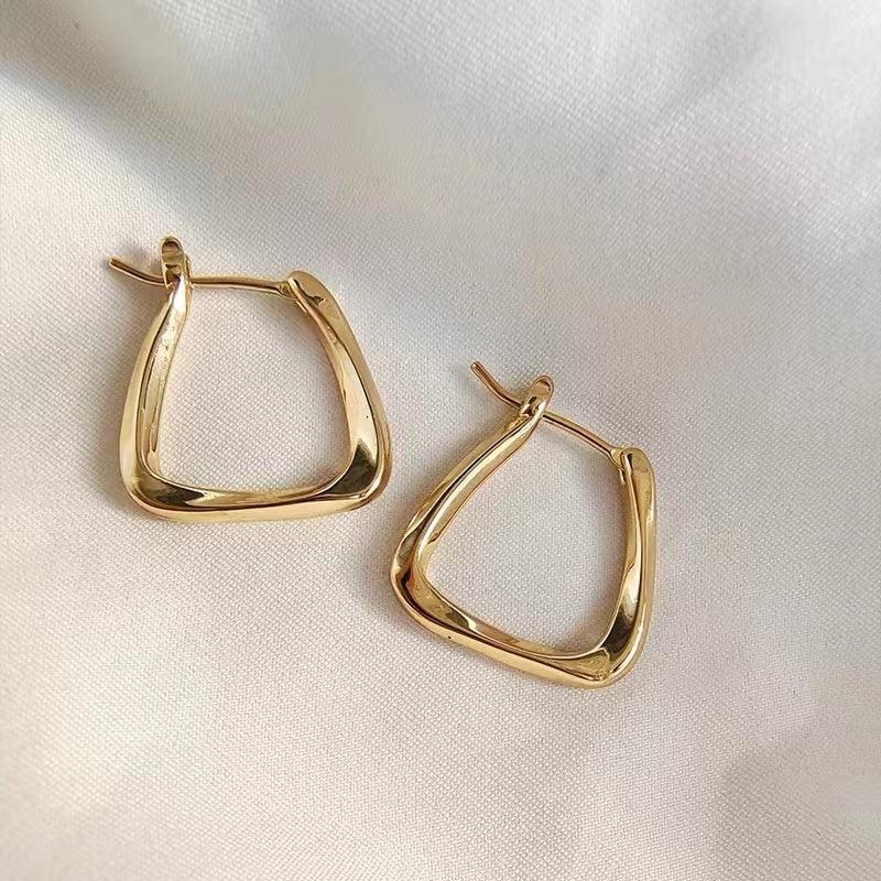 Gold stud earrings