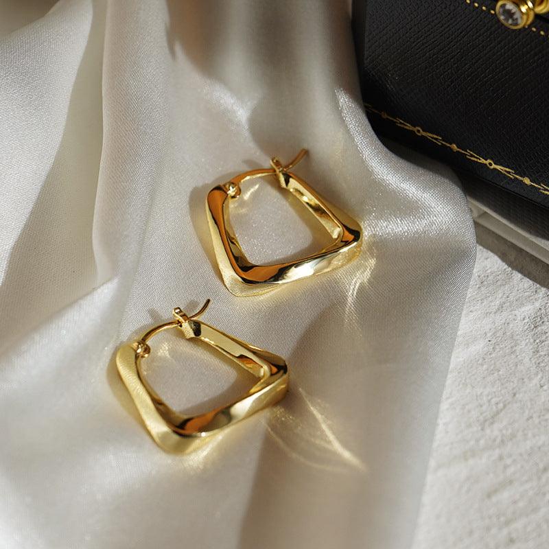 Gold stud earrings